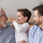 three generations of men having fun at home