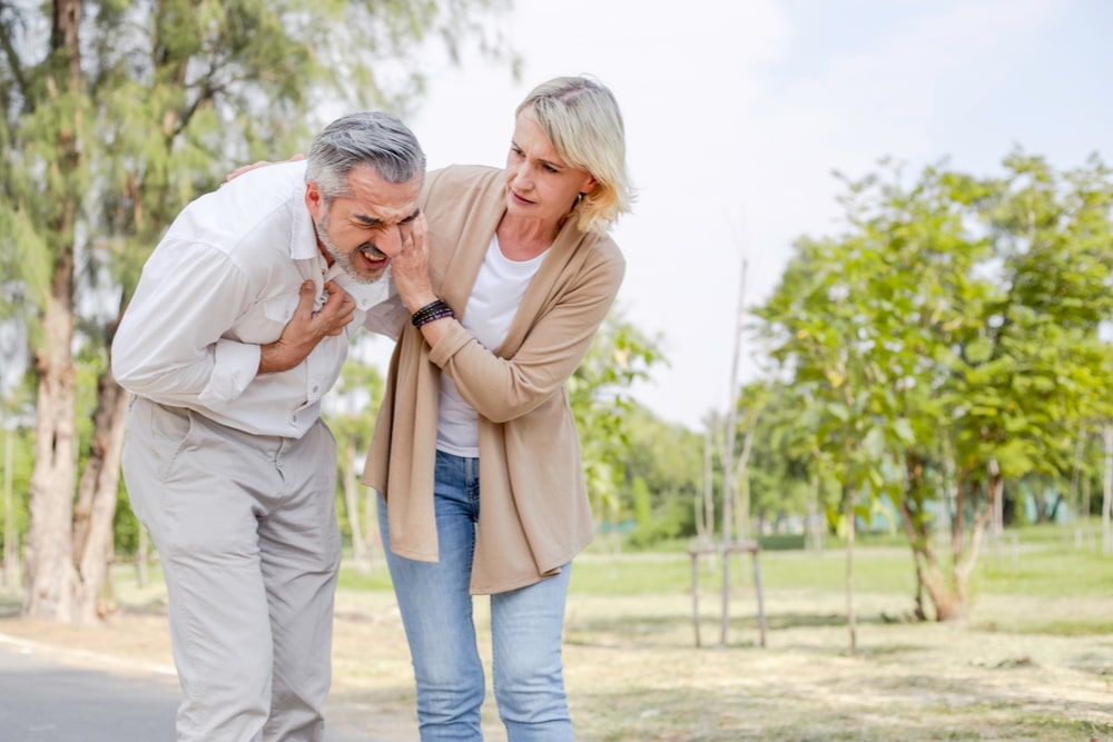 Man heart pain while walking in the park