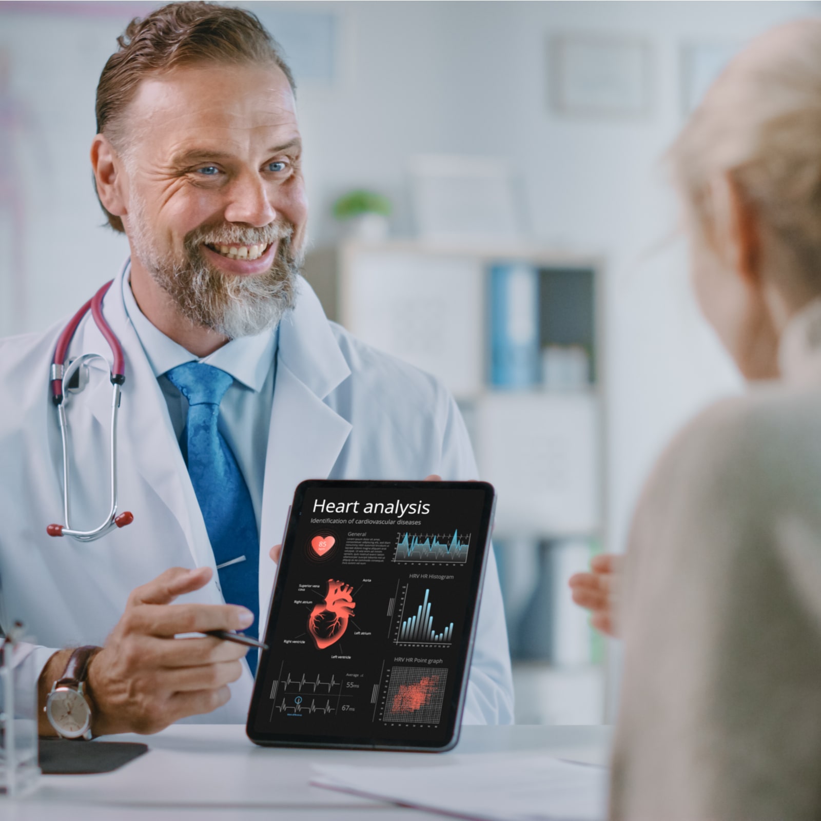Female Patient Listens to Experienced Cardiologist